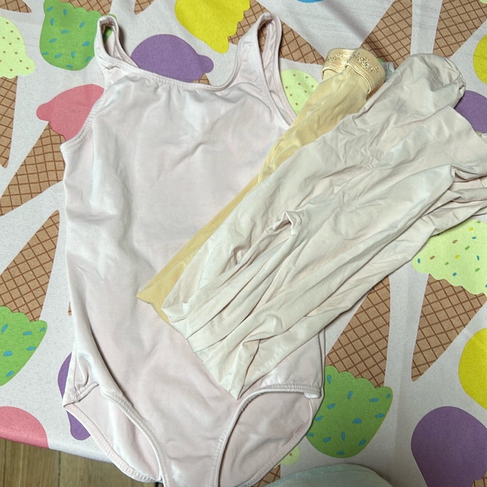 Girls medium revolution leotard and 2 pairs tights. Worn only once.